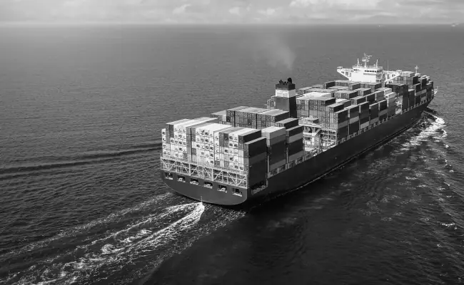A container ship carrying export goods across the ocean
